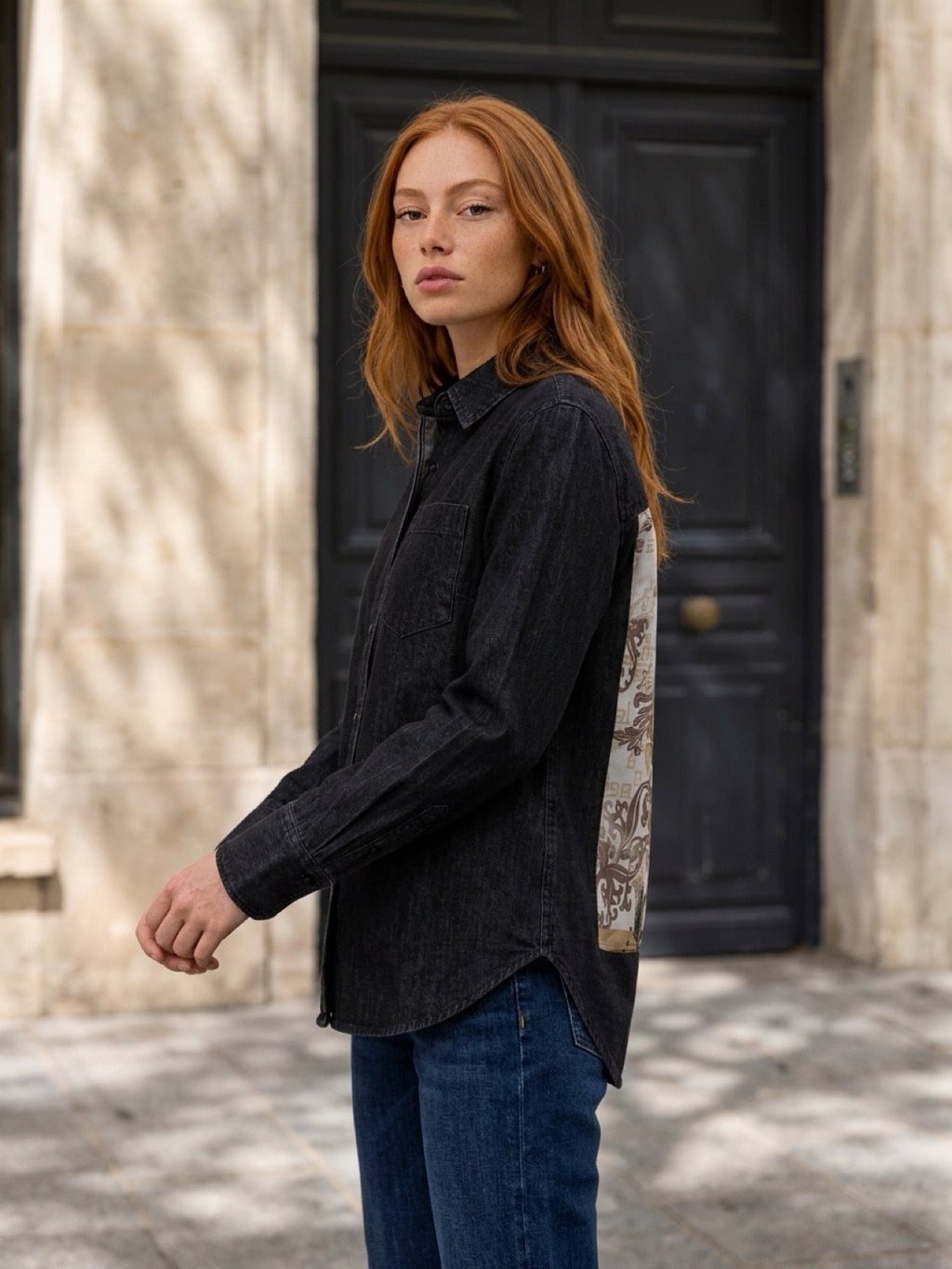 Second Soie model wearing a washed-black denim overshirt with an ivory and gold floral scarf panel on the back