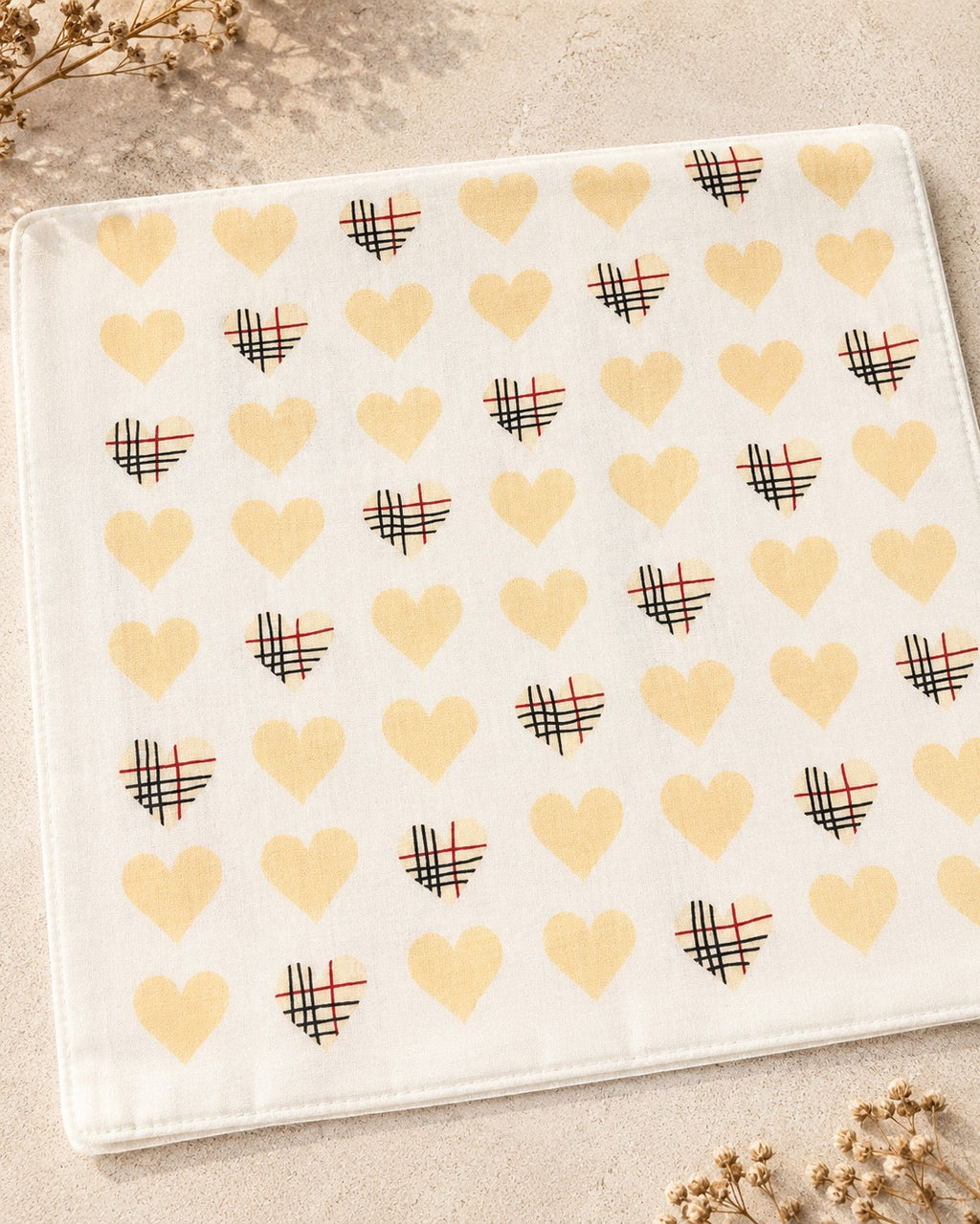Second Soie jumbo scrunchie fabric featuring a cream background with yellow hearts and Burberry check patterns.