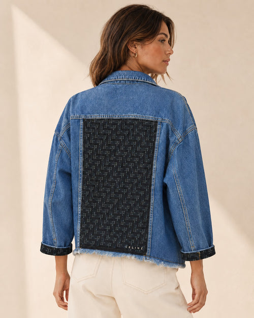 Second Soie cropped blue denim jacket with a black Celine scarf panel on the back and matching scarf-detailed cuffs.