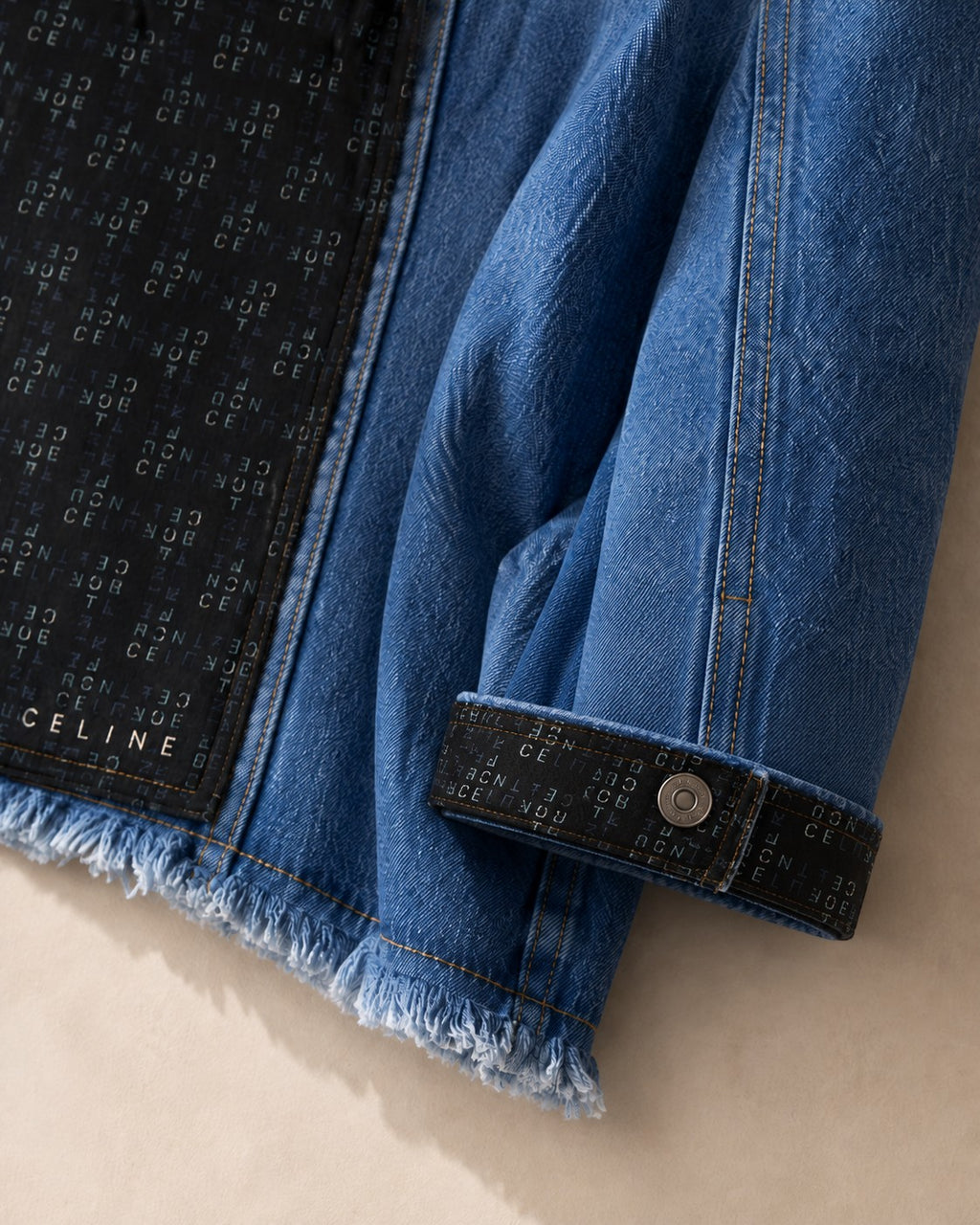 Second Soie cropped blue denim jacket featuring a black Celine scarf panel on the back and matching scarf cuffs.