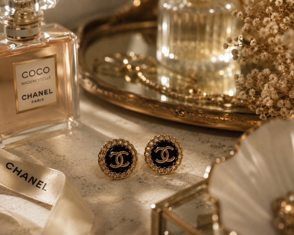 Second Soie vintage Chanel button earrings with black enamel, gold-tone chain border, and interlocking CC logo.