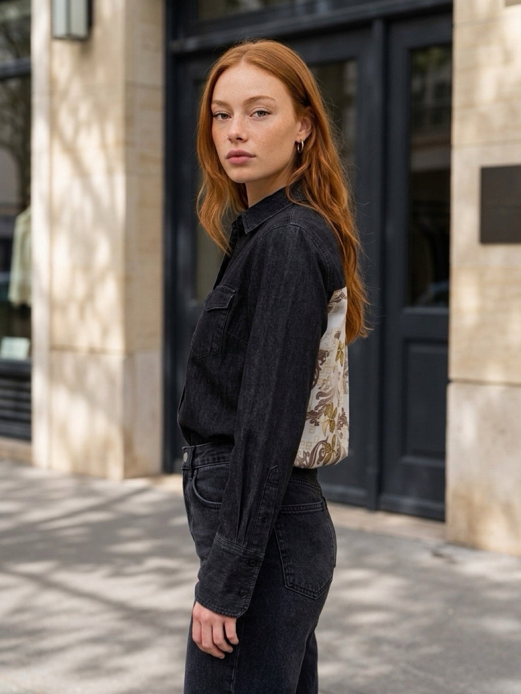 Second Soie model wearing a washed-black denim overshirt with a floral Givenchy scarf panel on the back