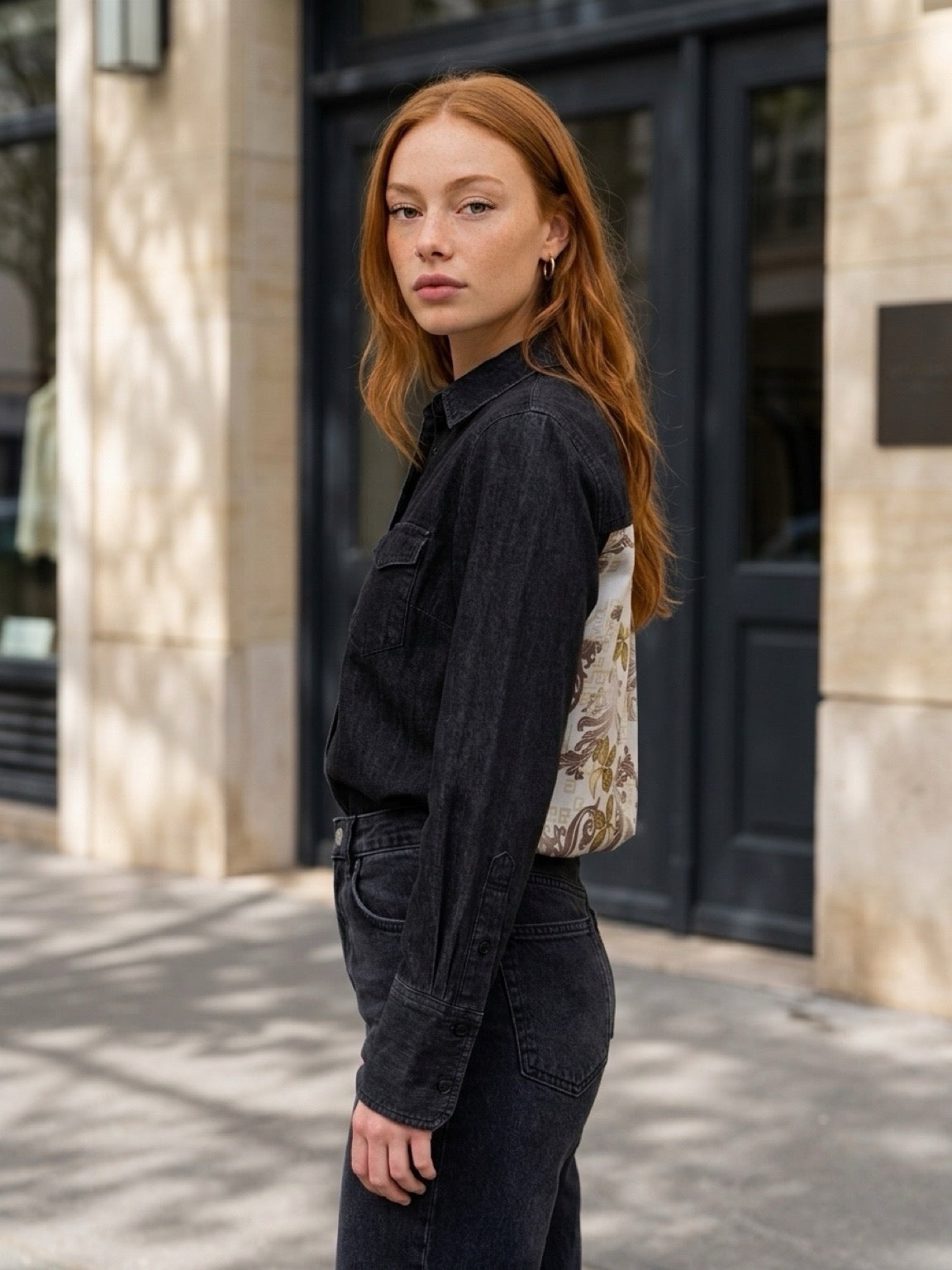 Second Soie model wearing a washed-black denim overshirt with a floral Givenchy scarf panel on the back