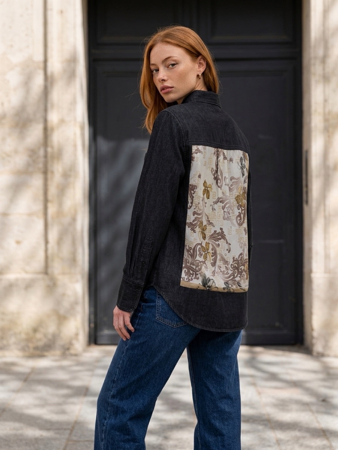 Second Soie reworked washed-black denim overshirt with a floral cotton scarf panel on the back, worn by a model.