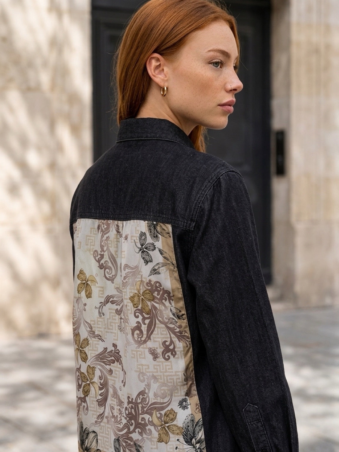 Model wearing a Second Soie washed-black denim overshirt with an ivory and gold floral Givenchy scarf back panel