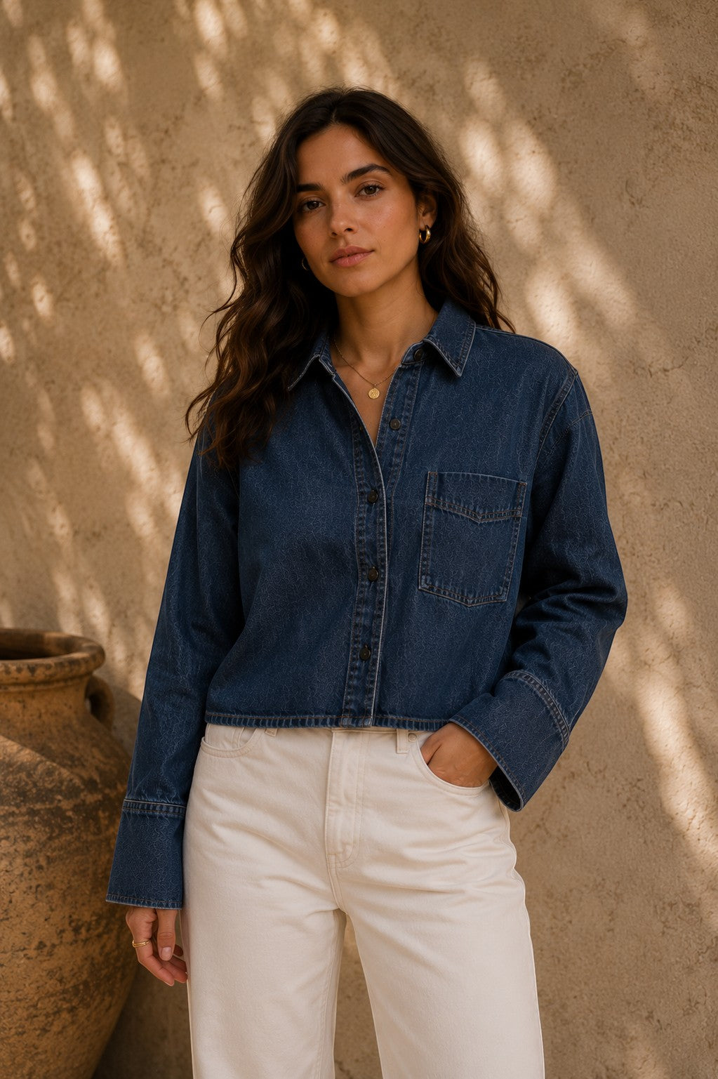 Model wearing a Second Soie denim jacket with a vintage Yves Saint Laurent scarf panel on the back, front view.