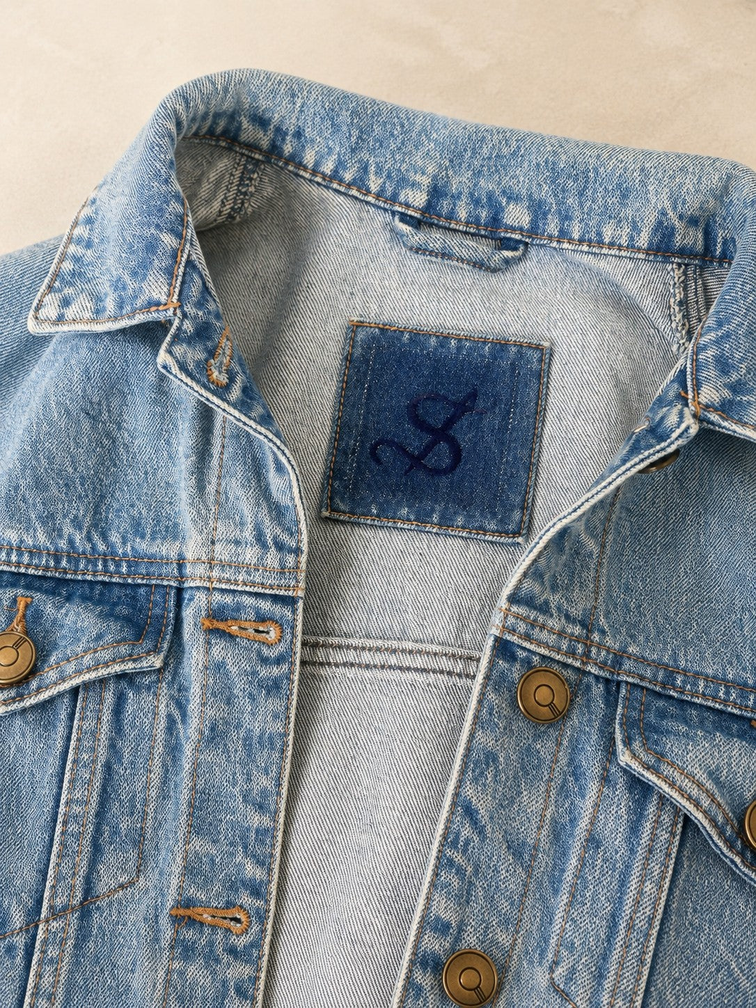 Second Soie reimagined denim jacket featuring antiqued-brass buttons and a custom velvet monogram label at the neck
