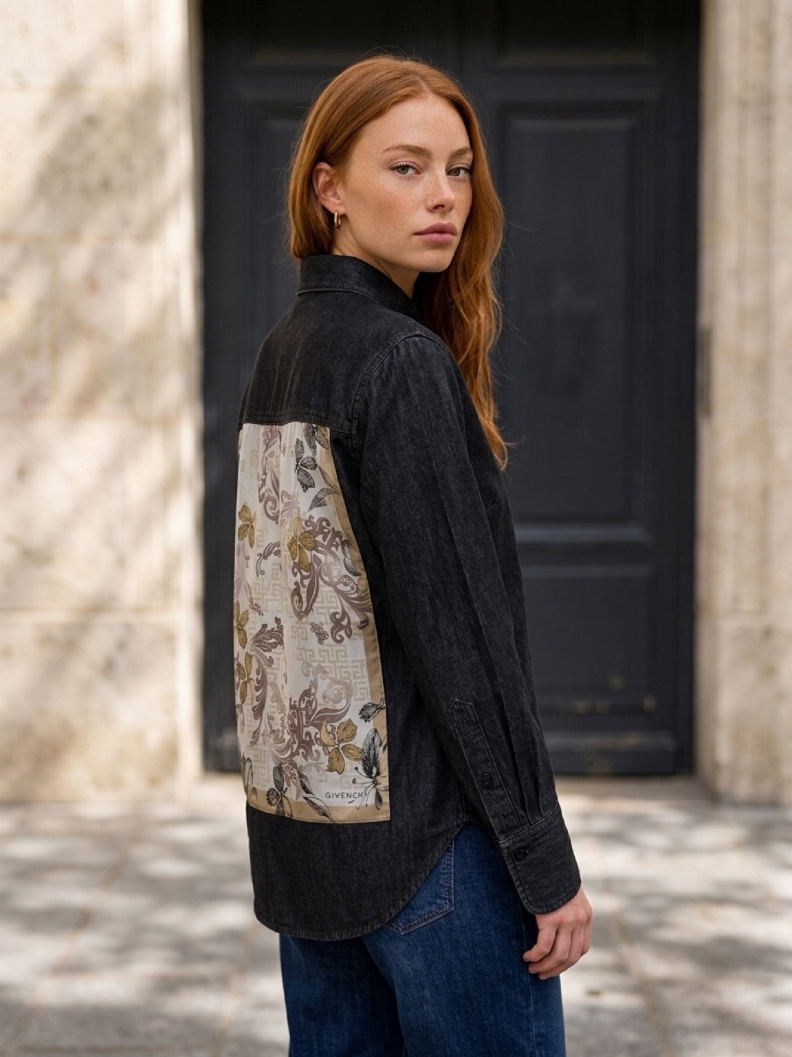 Model wearing a Second Soie washed-black denim overshirt with a floral Givenchy scarf panel on the back