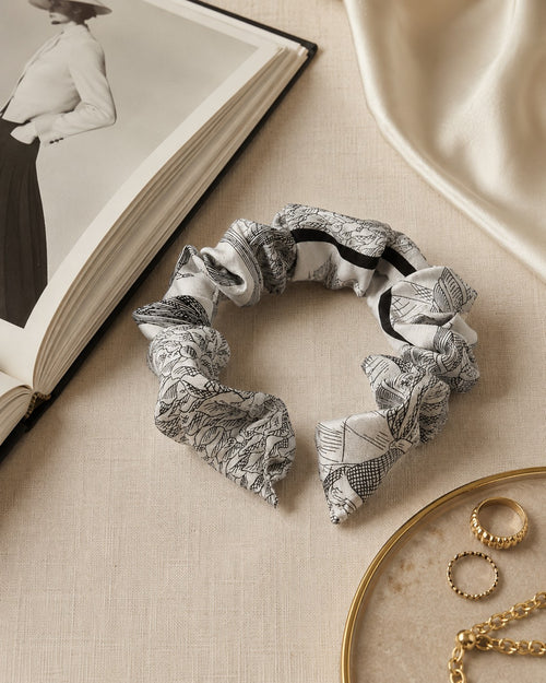 Second Soie handmade headband crafted from an authentic Dior silk scarf with a pale neutral base and black print.