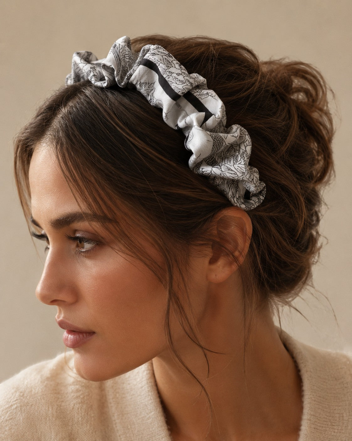 Second Soie handmade headband crafted from an authentic Dior silk scarf with a pale neutral and black illustrated print.