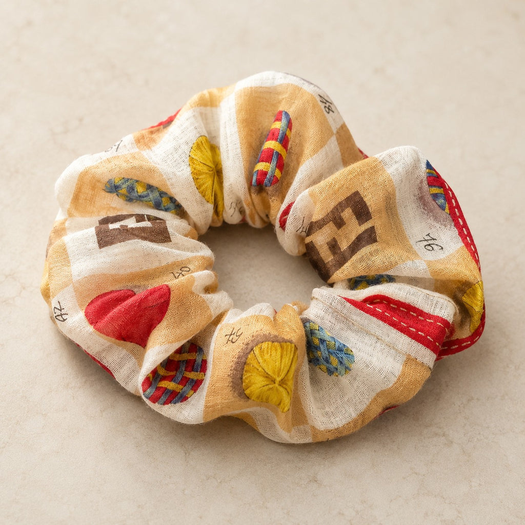 Second Soie Fendi handkerchief scrunchie in cream, tan, and brown with red, blue, and yellow patterned accents.