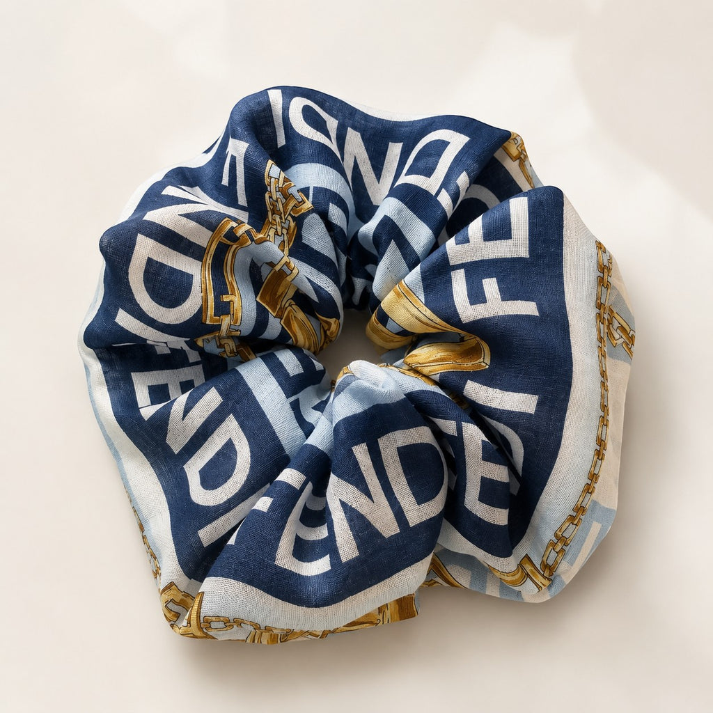 Second Soie jumbo Fendi scarf scrunchie in navy, ice blue, and white with gold chain print and bold lettering.