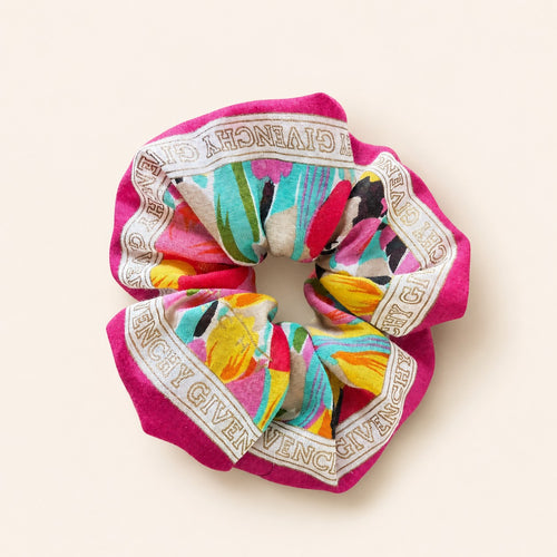 Second Soie handmade scrunchie crafted from a vintage Givenchy scarf with a fuchsia border and multicolor floral print.