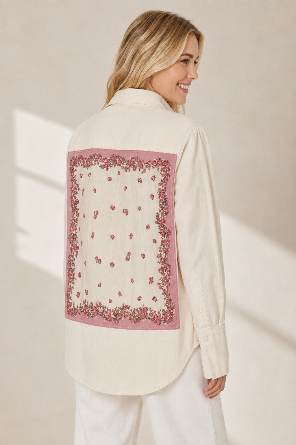Model wearing a Second Soie ivory denim overshirt featuring a vintage Pierre Balmain floral scarf panel on the back.