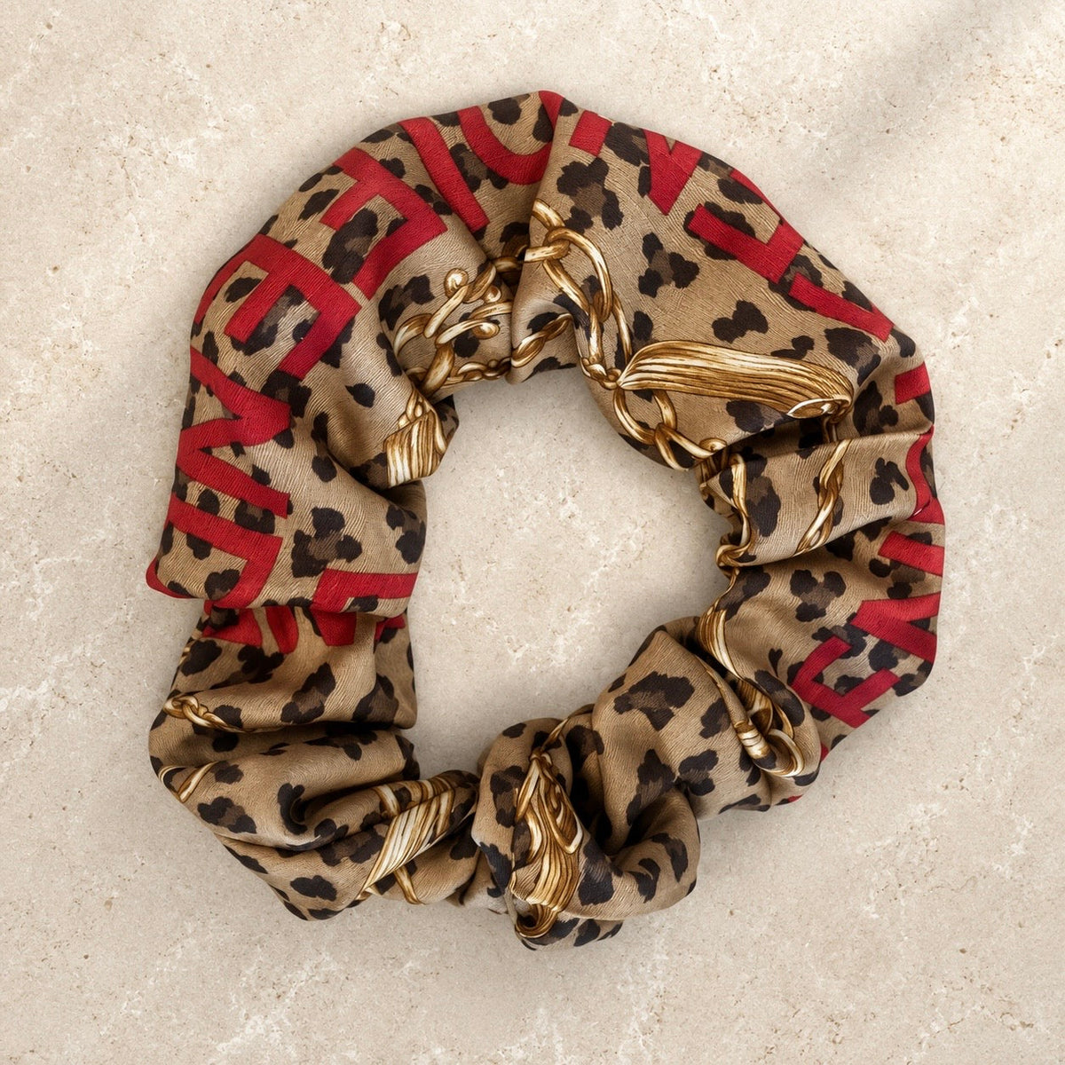 Second Soie leopard print scrunchie made from vintage Fendi scarf with gold chain motifs and red lettering