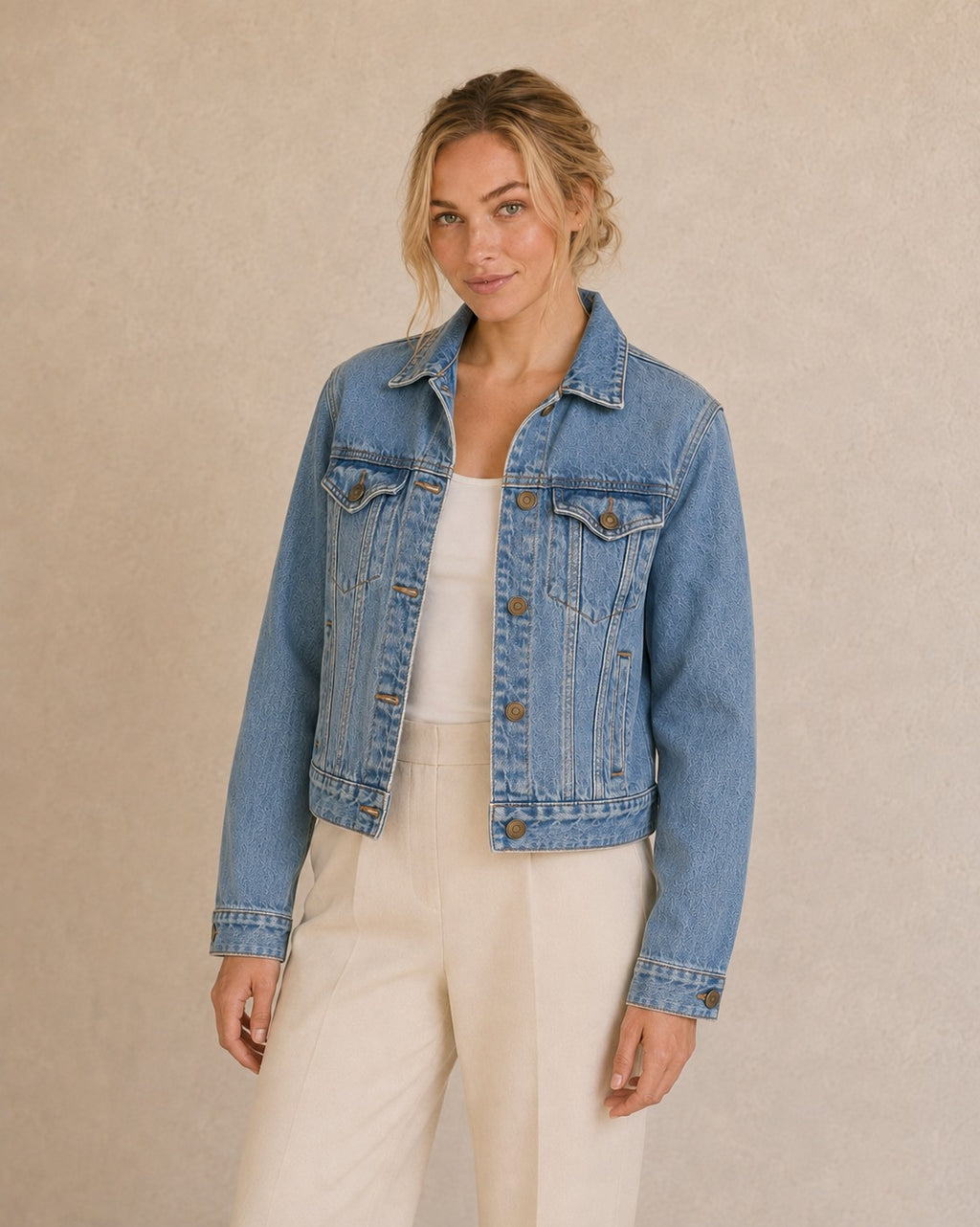 Model wearing a Second Soie reimagined denim jacket with a Polo Ralph Lauren bear print on the back and cuffs.