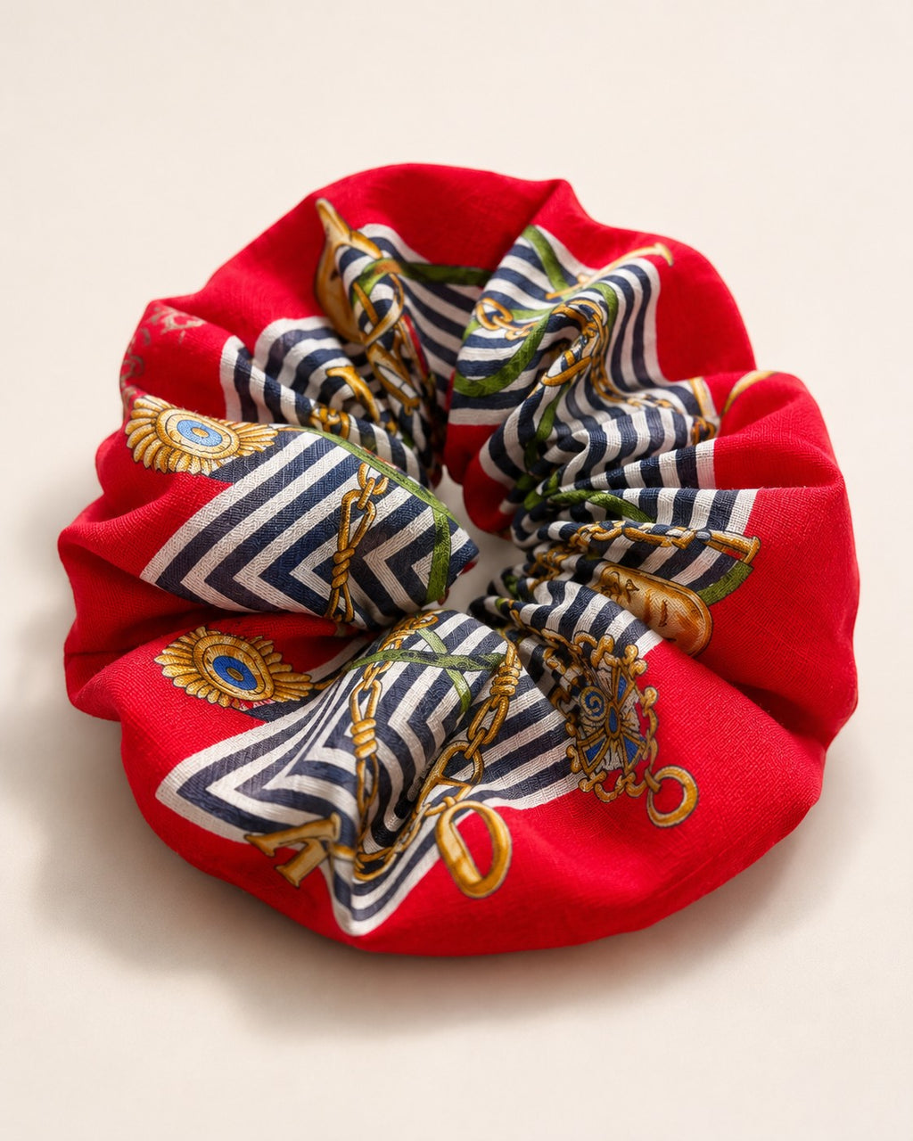 Second Soie vintage Roberta di Camerino scrunchie in red with navy, white, and gold chain and medallion print.