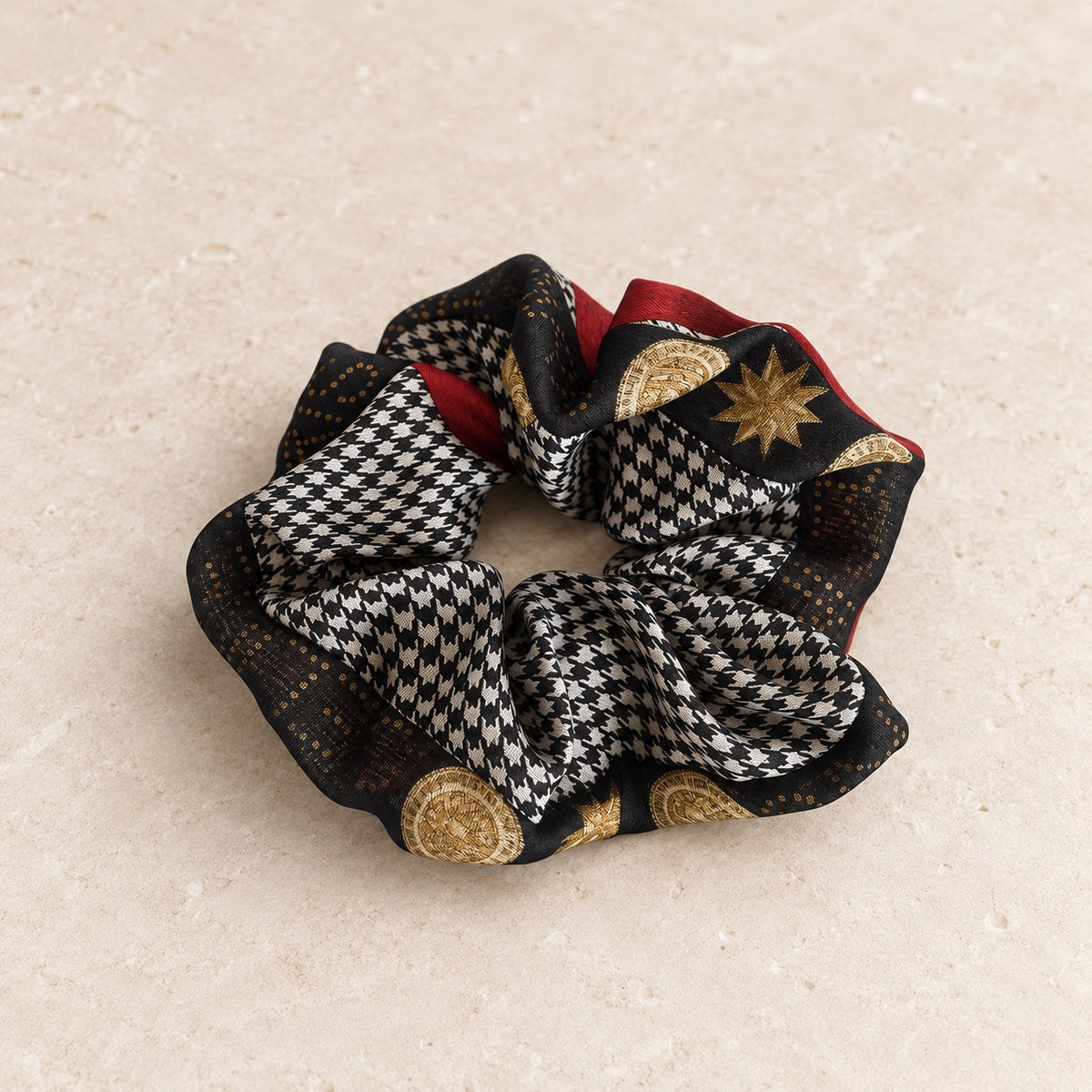 Second Soie jumbo scrunchie made from vintage Celine silk featuring black and ivory houndstooth with gold medallions.