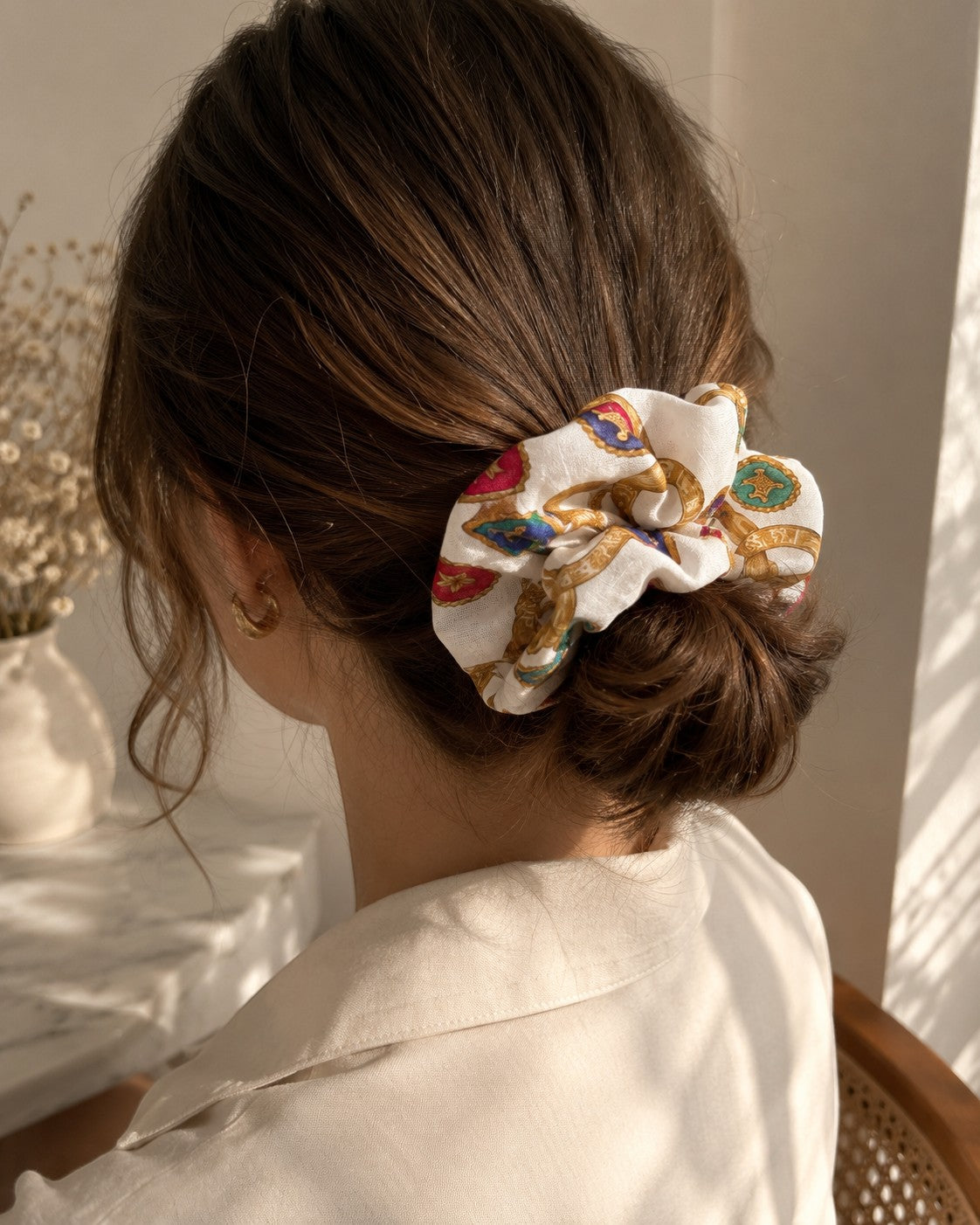 Second Soie oversized scrunchie made from a vintage Celine handkerchief with a white, red, and gold patterned print.