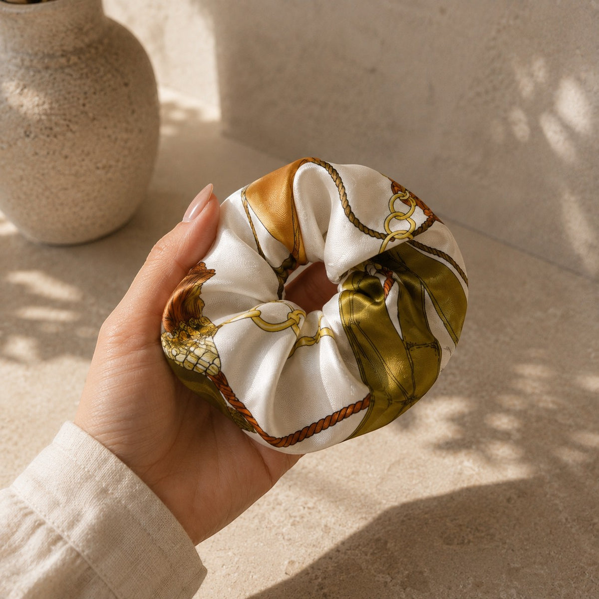 Second Soie jumbo silk scrunchie featuring a vintage Celine Paris equestrian print in ivory, olive, and gold tones.