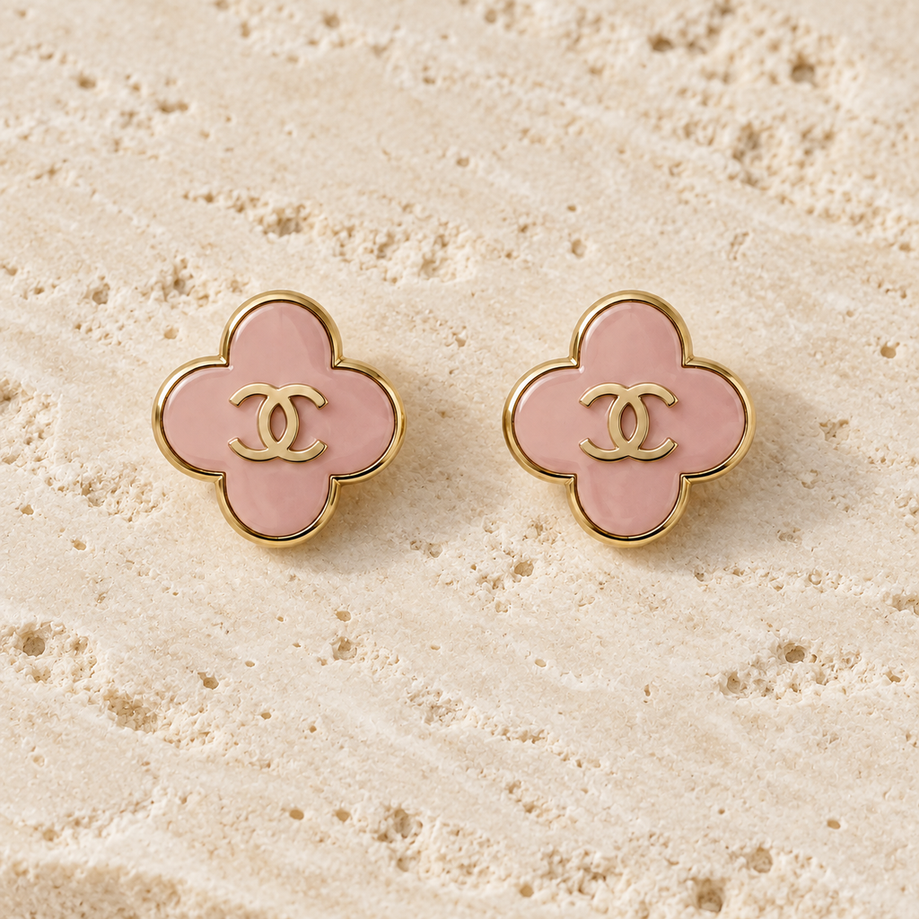 Second Soie vintage Chanel button earrings featuring blush-pink enamel clover shapes with gold-tone CC logos.