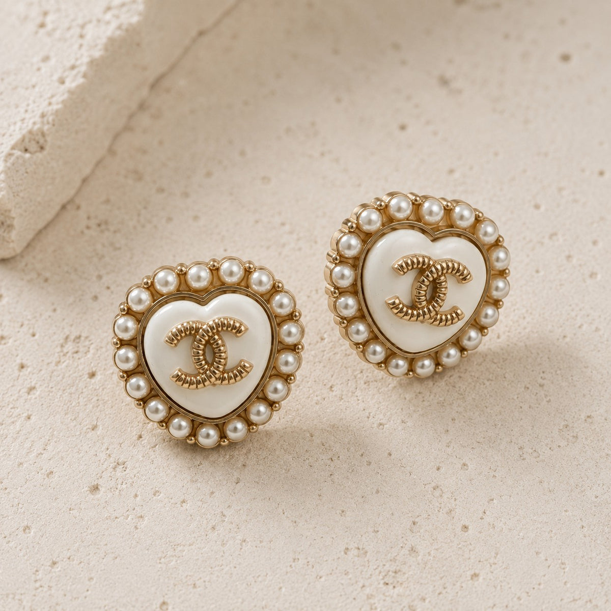 Second Soie vintage Chanel heart button earrings with ivory enamel, faux pearl halo, and gold CC logo on stone base