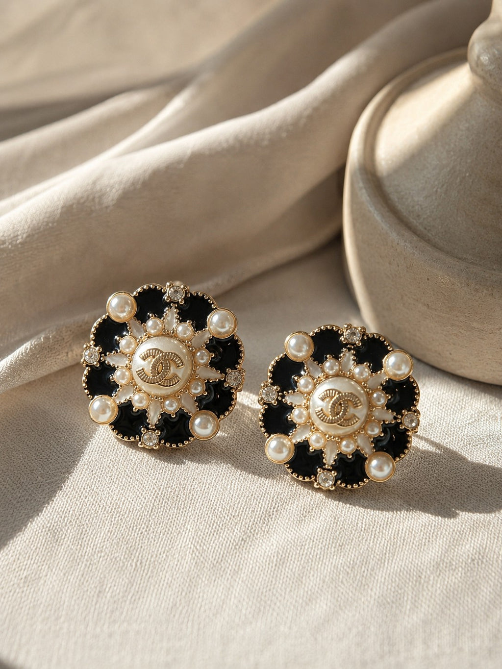 Second Soie vintage Chanel button earrings featuring black enamel, faux pearls, crystal accents, and gold-tone details.