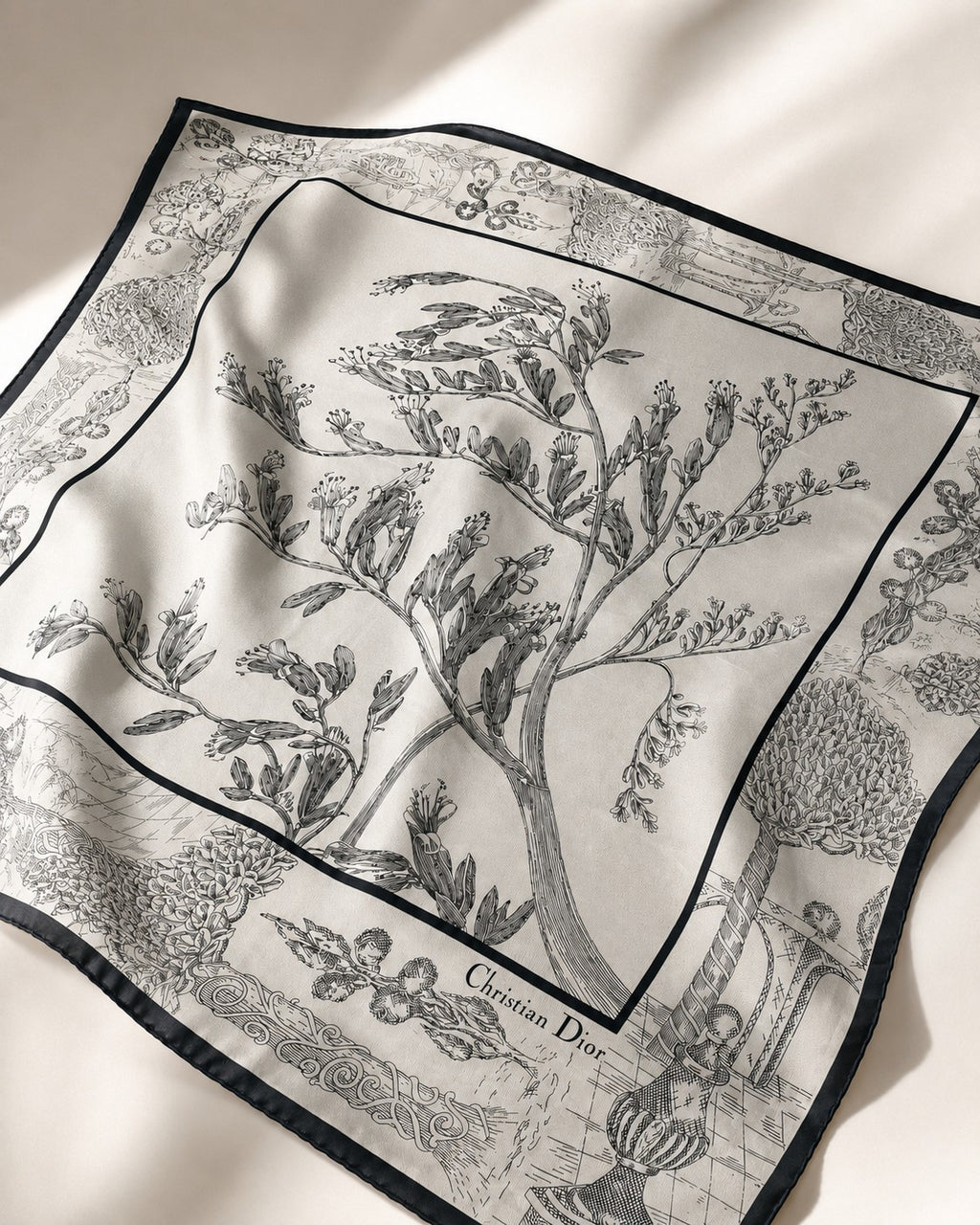 Second Soie vintage Christian Dior silk scarf in silver-gray with black botanical linework and ornate border details.