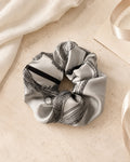 Second Soie handcrafted scrunchie made from a vintage silver-gray and black Christian Dior silk scarf