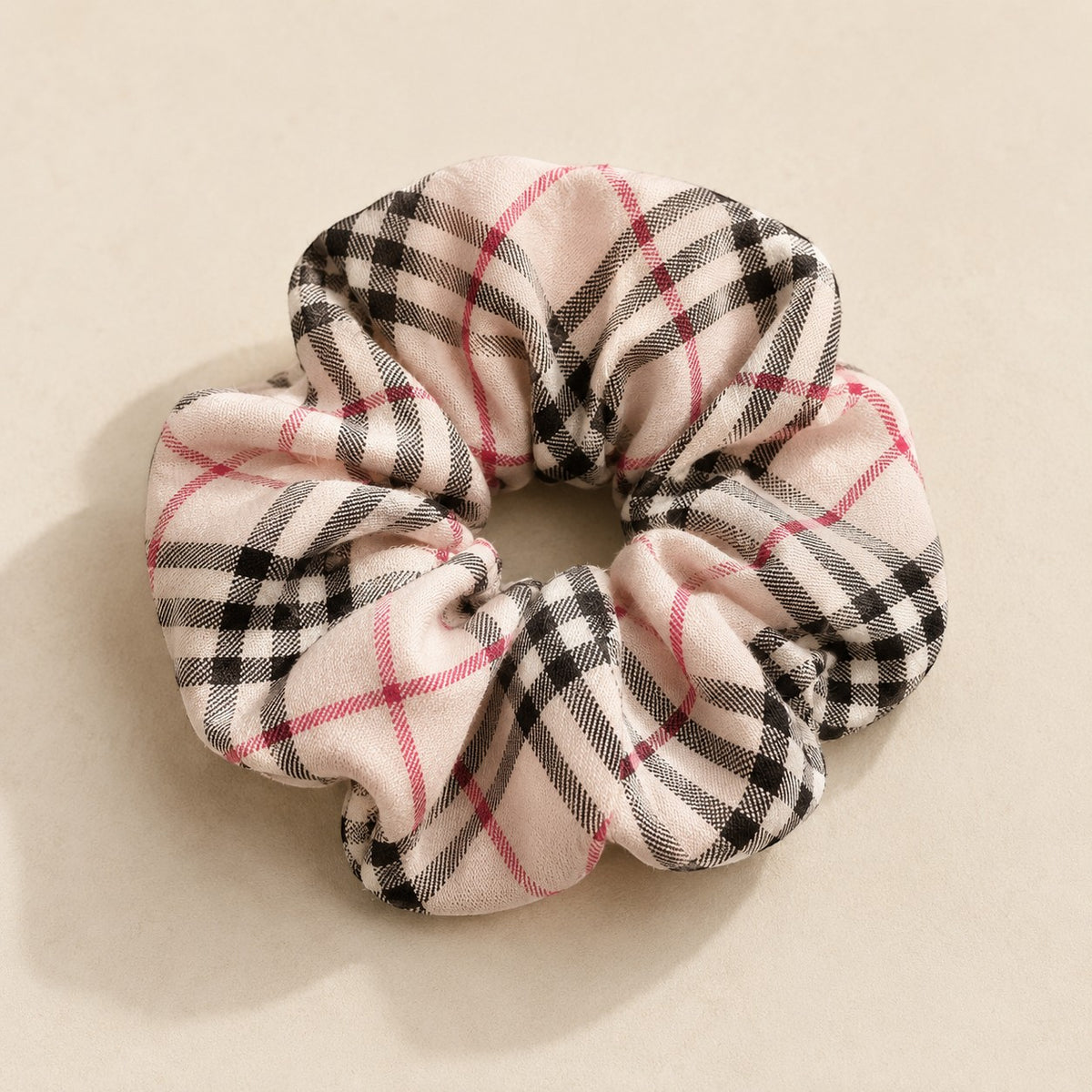 Second Soie jumbo scrunchie in a neutral plaid vintage cotton fabric with black and red check pattern.